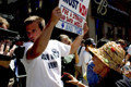 bush supporter, anti-bush marchers, united for peace & justice march, 34th street, nyc, august 2004