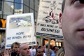 pro-bush signs, anti-bush signs, united for peace & justice march, herald square, nyc, august 2004